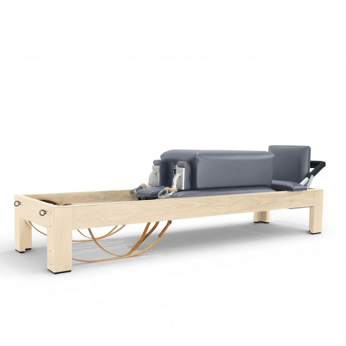 Elina Pilates Classic Natural Wood Reformer in solid maple with leather straps, wooden handles and a classic footbar