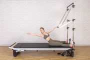 Align Pilates A8-Pro with Half Cadillac, seated side reach holding the push through bar