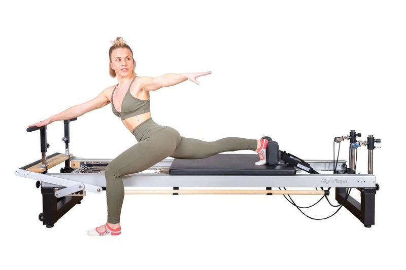 Align Pilates A8-Pro, instructor performing a standing split