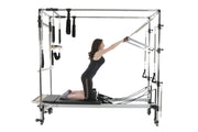 Align Pilates C8-Pro with Full Cadillac, user kneeling and pushing the push through bar