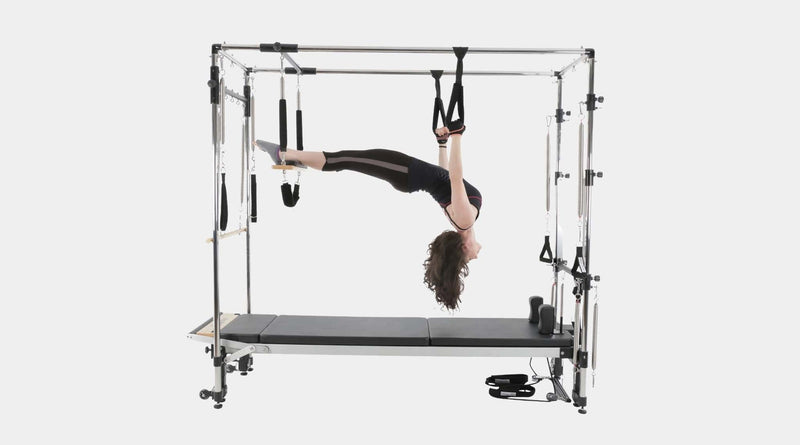 Align Pilates C8-Pro with Full Cadillac, user working in the trapeze straps