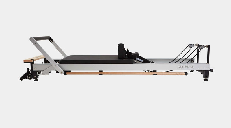 Align Pilates C8-Pro Reformer, full side profile on a grey background