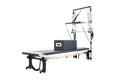 Align Pilates C8-Pro with Half Cadillac, three quarter view on a white background with a sitting box on the carriage