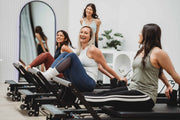 Align Pilates C8-Pro Noir, clients laughing during a group class