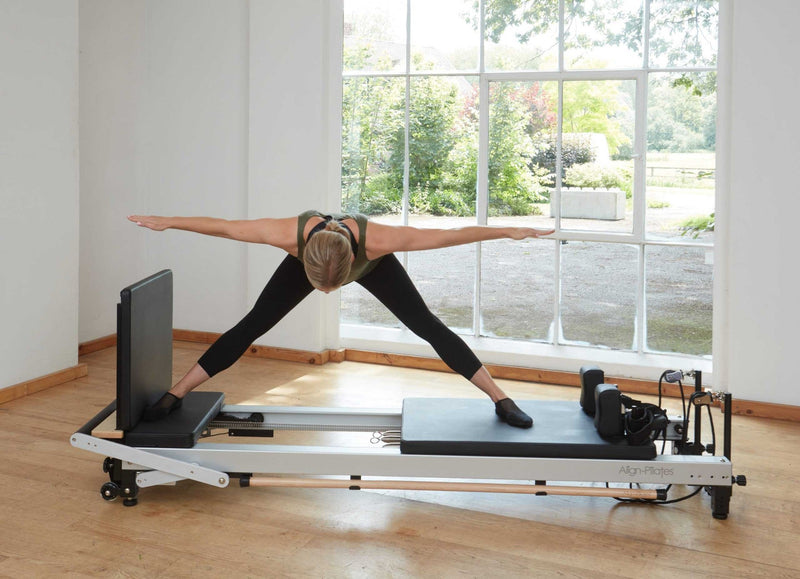 Align Pilates C8-Pro Reformer, woman performing a standing split
