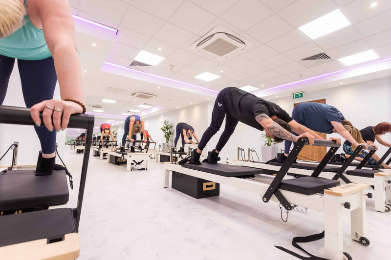 Align Pilates C8-S Pro, group class on a row of reformers