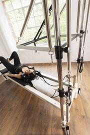 Align Pilates C8-S with Half Cadillac, low angle view of the stainless steel uprights