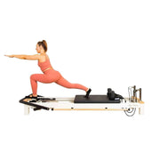 Align Pilates C8-S Pro, instructor in a standing lunge on the reformer