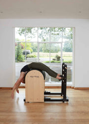 Align Pilates Ladder Barrel RC, woman in a back extension over the barrel