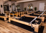 Align Pilates M8-Pro, row of maple reformers in a studio