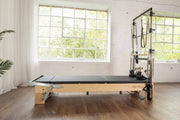 Align Pilates Mat Converter for M Series, side view of the flat bed in a studio