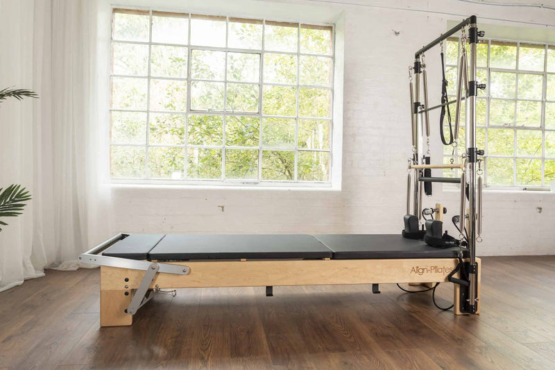 Align Pilates Mat Converter for M Series, fitted to a maple reformer with a half cadillac
