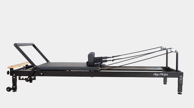 Align Pilates R8-Pro Reformer, black frame profile on a grey background