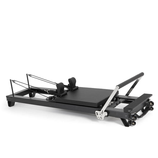 Elina Pilates HL 2 Aluminium Reformer, black anodised frame, angled studio view