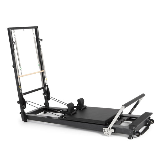 Elina Pilates HL 1 Aluminium Reformer with Tower, wooden push-through bar, angled studio view
