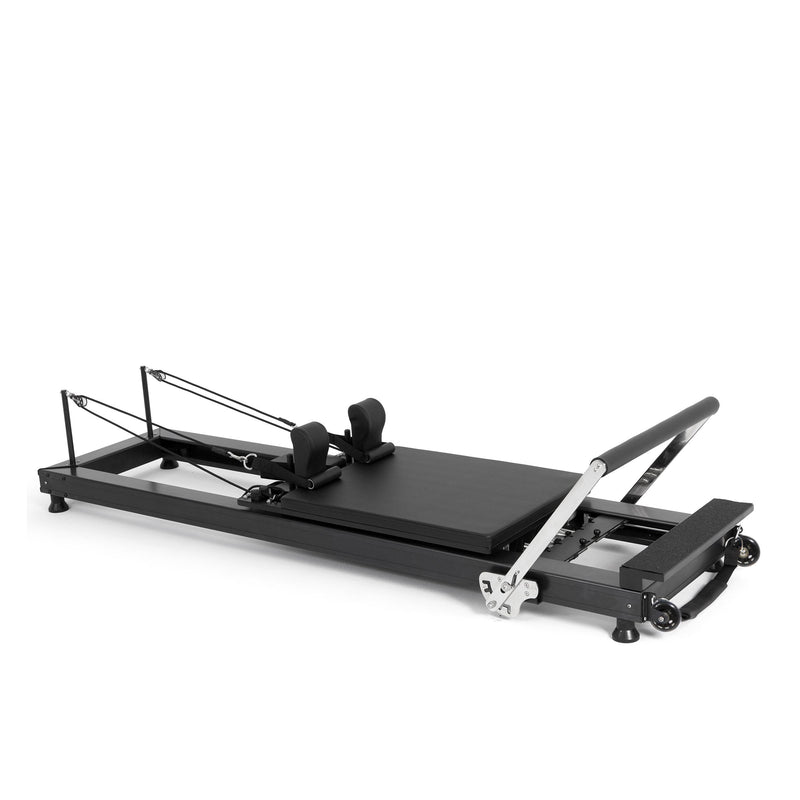 Elina Pilates HL 1 Aluminium Reformer, black anodised frame, angled studio view