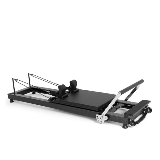 Elina Pilates HL 1 Aluminium Reformer, black anodised frame, angled studio view