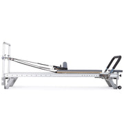 Mentor Reformer side view, grey upholstery