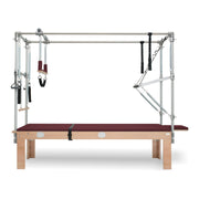 BASI Systems Cadillac Trapeze Table upholstered in Burgundy, the whole apparatus shown against a plain background