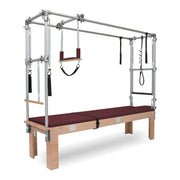 BASI Systems Cadillac Trapeze Table upholstered in Burgundy, the whole apparatus shown against a plain background, second view
