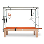 BASI Systems Cadillac Trapeze Table upholstered in Campfire Orange, the whole apparatus shown against a plain background