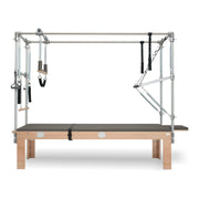 BASI Systems Cadillac Trapeze Table upholstered in Dark Cool Sand, the whole apparatus shown against a plain background