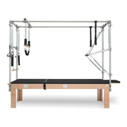 BASI Systems Cadillac Trapeze Table upholstered in Moonless Night Black, the whole apparatus shown against a plain background