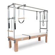 BASI Systems Cadillac Trapeze Table upholstered in Pristine White, the whole apparatus shown against a plain background