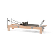 BASI Systems Compact Reformer upholstered in Dark Cool Sand, the whole apparatus shown against a plain background