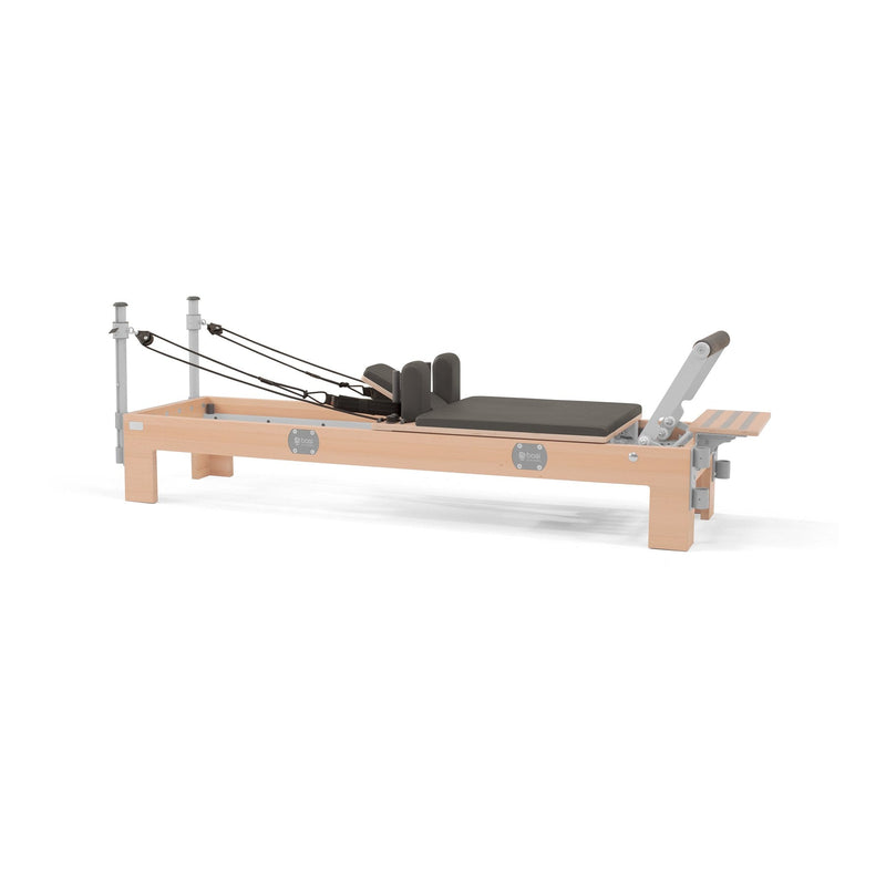 BASI Systems Compact Reformer upholstered in Dark Cool Sand, the whole apparatus shown against a plain background