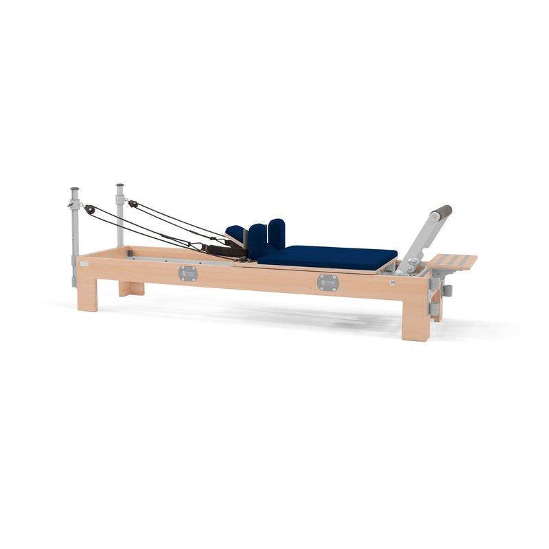BASI Systems Compact Reformer upholstered in Dark Navy, the whole apparatus shown against a plain background