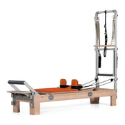 BASI Systems Compact Reformer with Tower upholstered in Campfire Orange, the whole apparatus shown against a plain background
