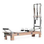 BASI Systems Compact Reformer with Tower upholstered in Pristine White, the whole apparatus shown against a plain background