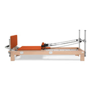 BASI Systems Reformer upholstered in Campfire Orange, the whole apparatus shown against a plain background, third view