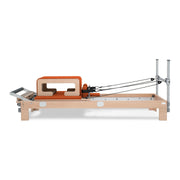 BASI Systems Reformer upholstered in Campfire Orange, the whole apparatus shown against a plain background, view 4