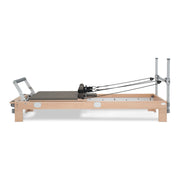BASI Systems Reformer upholstered in Dark Cool Sand, the whole apparatus shown against a plain background, second view