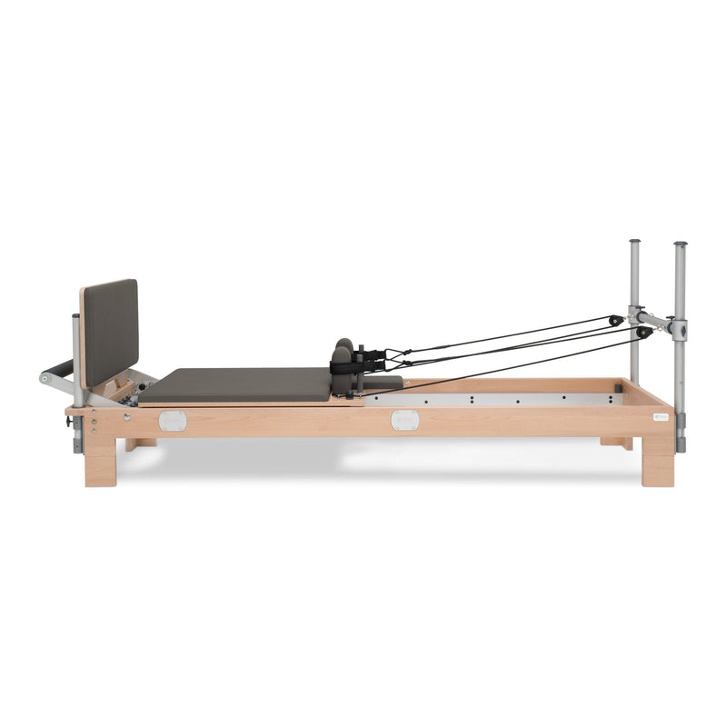 BASI Systems Reformer upholstered in Dark Cool Sand, the whole apparatus shown against a plain background, third view