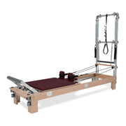 BASI Systems Reformer with Tower upholstered in Burgundy, the whole apparatus shown against a plain background
