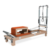 BASI Systems Reformer with Tower upholstered in Campfire Orange, the whole apparatus shown against a plain background, second view