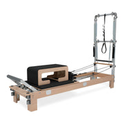 BASI Systems Reformer with Tower upholstered in Moonless Night Black, the whole apparatus shown against a plain background, second view