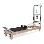 BASI Systems Reformer with Tower upholstered in Moonless Night Black, the whole apparatus shown against a plain background
