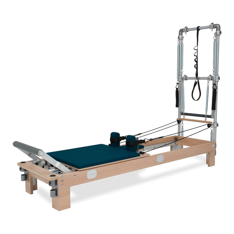BASI Systems Reformer with Tower upholstered in Petrol Green, the whole apparatus shown against a plain background
