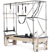 Elina Pilates Elite Cadillac Reformer in black, full trapeze frame, angled studio view