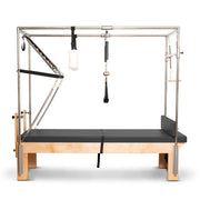 Elina Pilates Cadillac Reformer in grey, side view with the mats laid flat