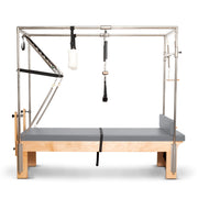 Elina Pilates Cadillac Reformer in grey, front view through the tower