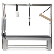 Elina Pilates Classic Aluminium Cadillac in black, front view with push-through bar and trapeze