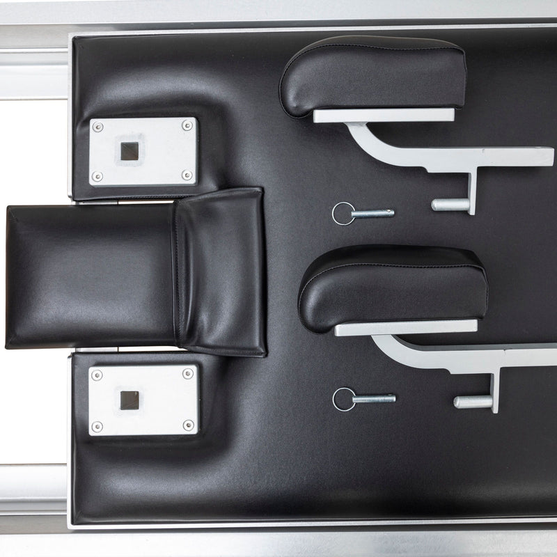 Headrest, shoulder rests, footbar brackets and locking pins from above, black