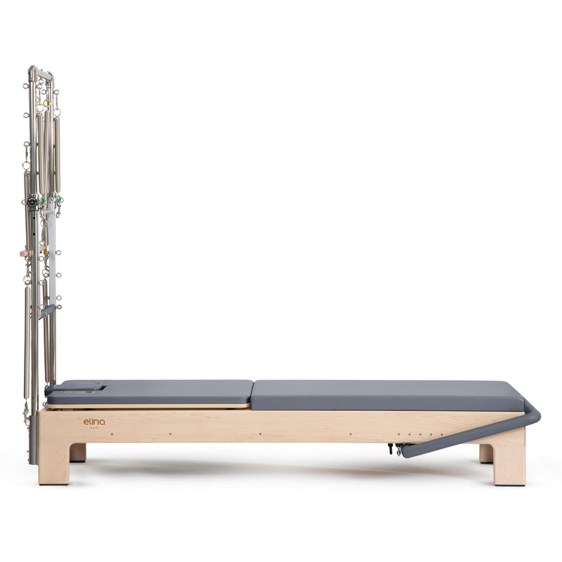 Elite Advanced Reformer with Tower side view, grey upholstery
