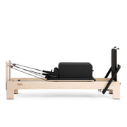 Elite Advanced Reformer with sitting box and jump board raised, black