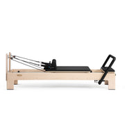 Elite Advanced Reformer side view, black upholstery